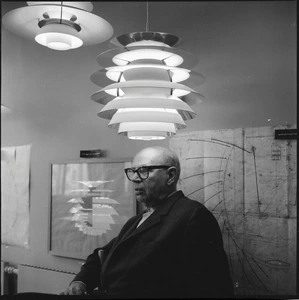 Poul Henningsen in his studio, designing iconic lighting pieces